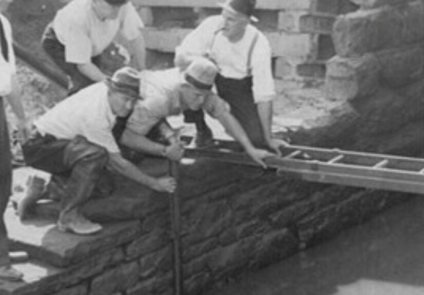 men looking into a river at Kingsbury run in Cleveland 1930s